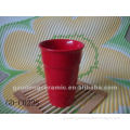 red ceramic tea mug without handle